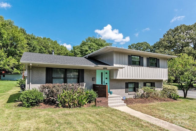 split level home featuring a front lawn