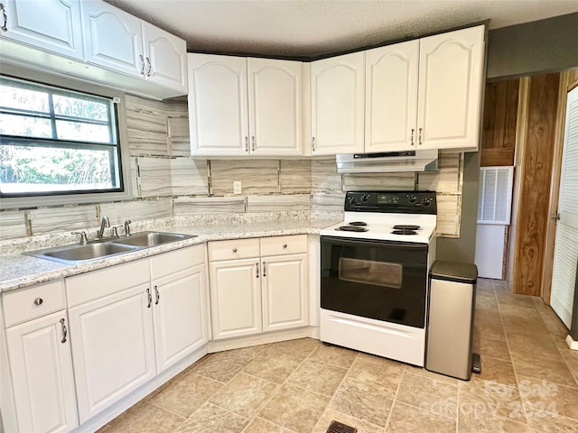 kitchen with white range with electric cooktop, white cabinets, sink, and decorative backsplash