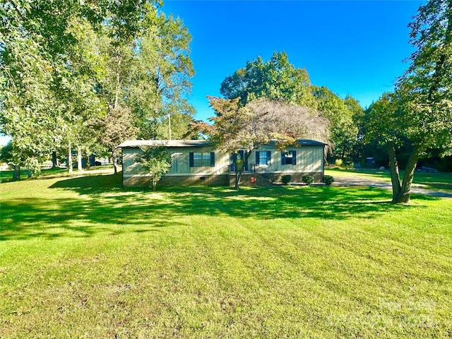 view of front facade with crawl space and a front yard