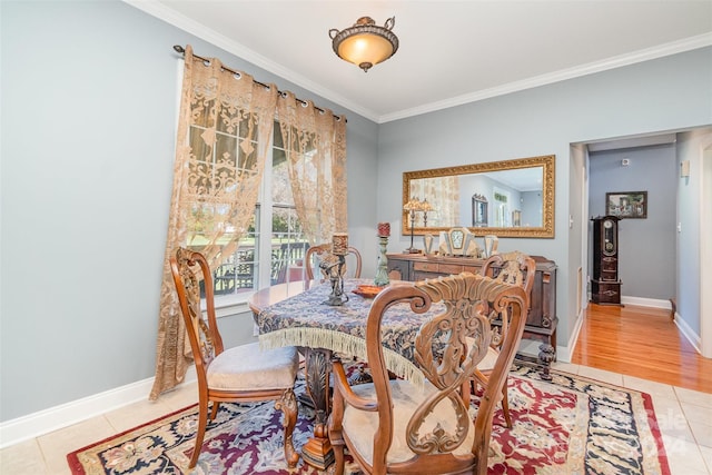 tiled dining room with crown molding