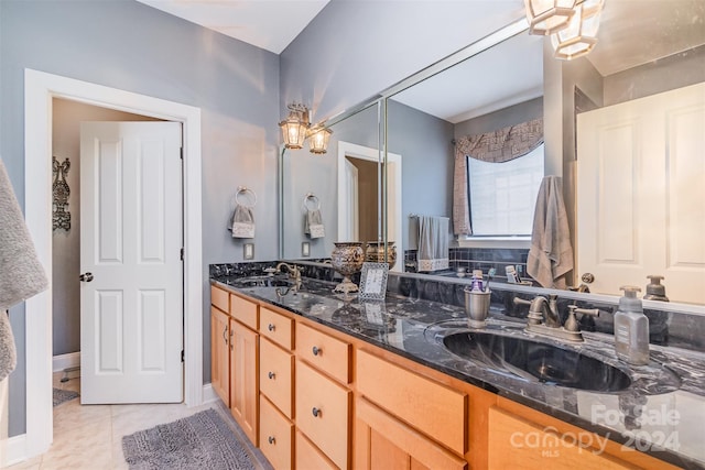 bathroom featuring tile patterned floors and vanity