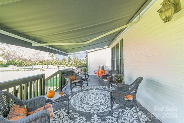 wooden deck featuring outdoor lounge area