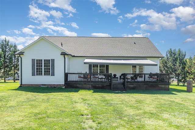 back of house featuring a yard and a wooden deck