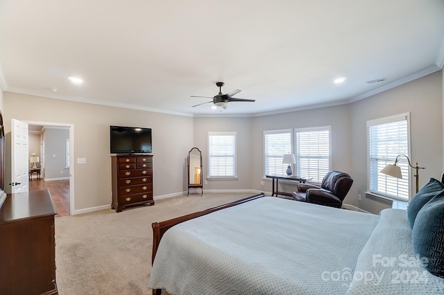 bedroom with ornamental molding, light carpet, and ceiling fan