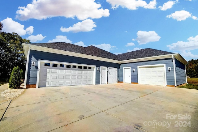 ranch-style house featuring a garage