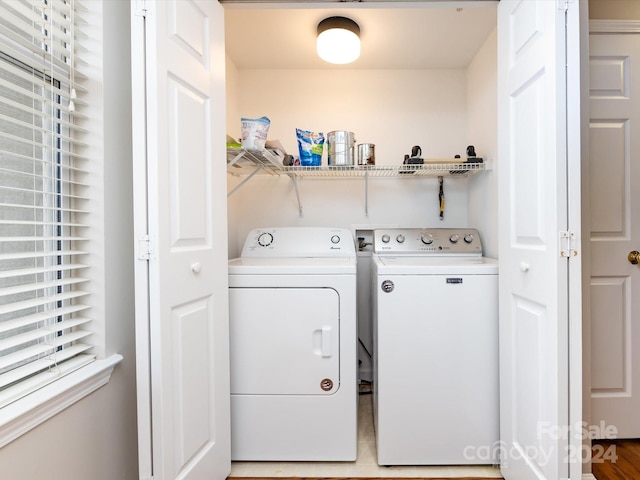 laundry room featuring separate washer and dryer