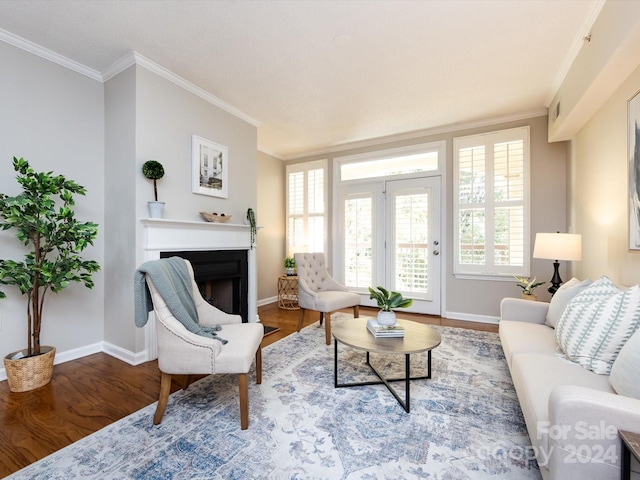 living room with ornamental molding and hardwood / wood-style floors