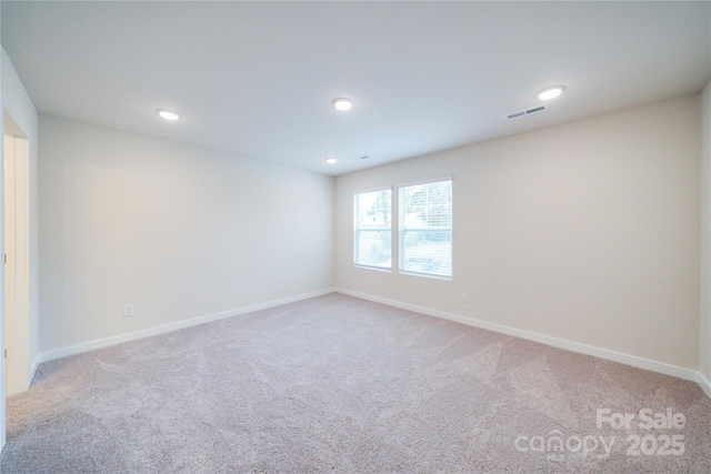 empty room with carpet flooring