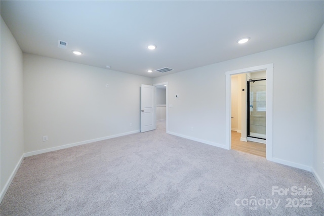 empty room with light colored carpet