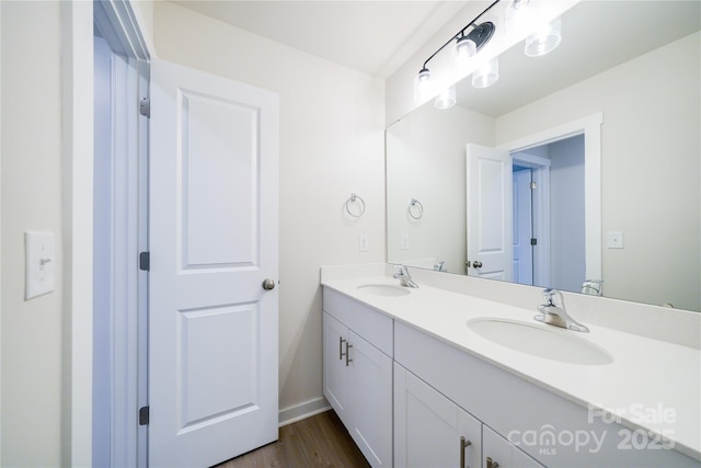 bathroom featuring vanity and wood-type flooring