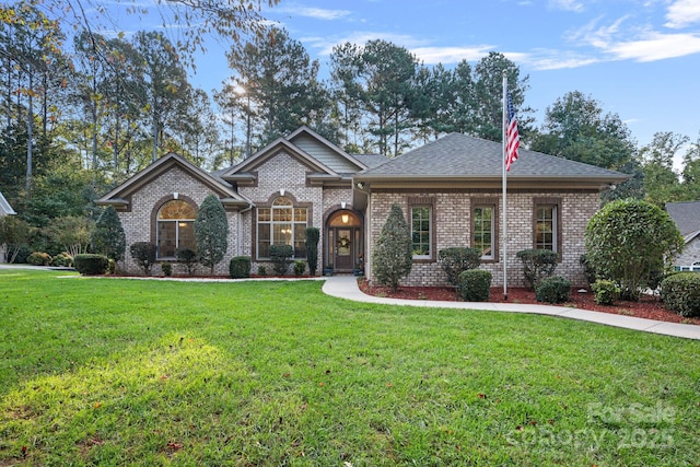 view of front of home with a front yard