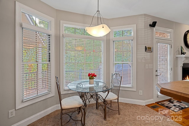 tiled dining area with a healthy amount of sunlight