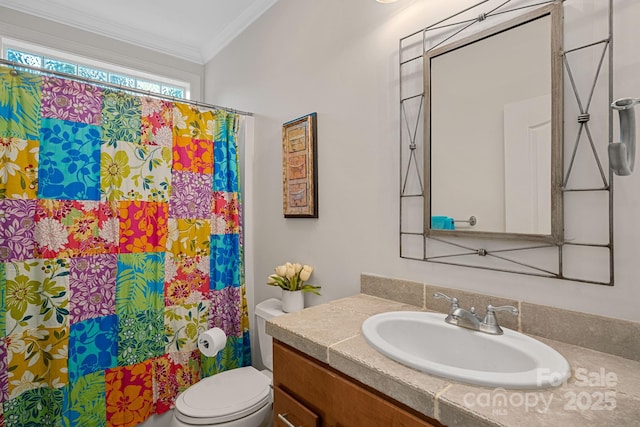 bathroom featuring walk in shower, crown molding, vanity, and toilet