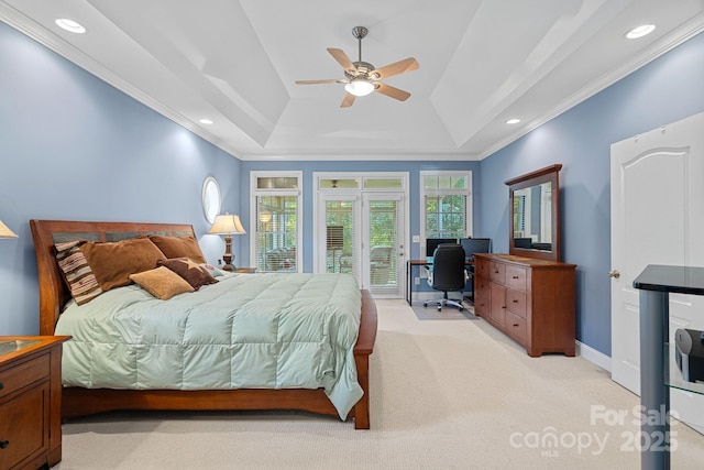 carpeted bedroom with access to exterior, a tray ceiling, ceiling fan, and crown molding