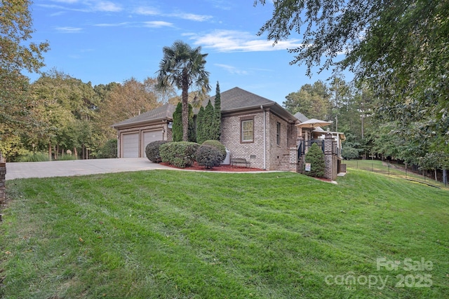 view of front of property with a garage and a front lawn