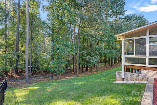 view of yard featuring a sunroom