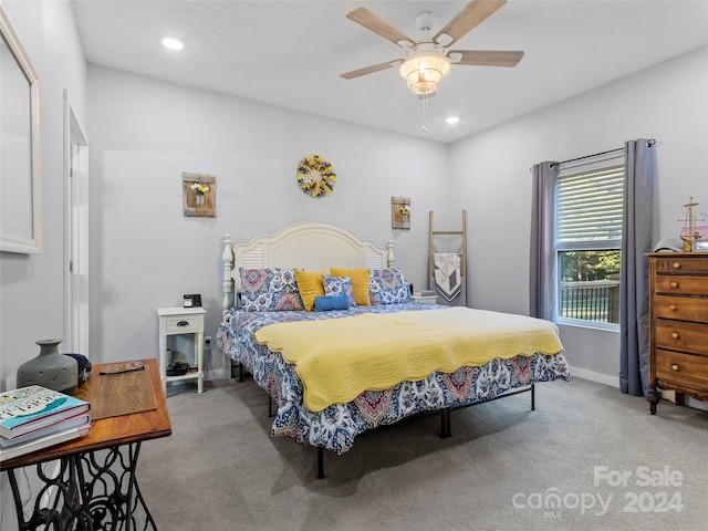 bedroom with light colored carpet and ceiling fan