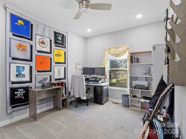 carpeted office featuring ceiling fan