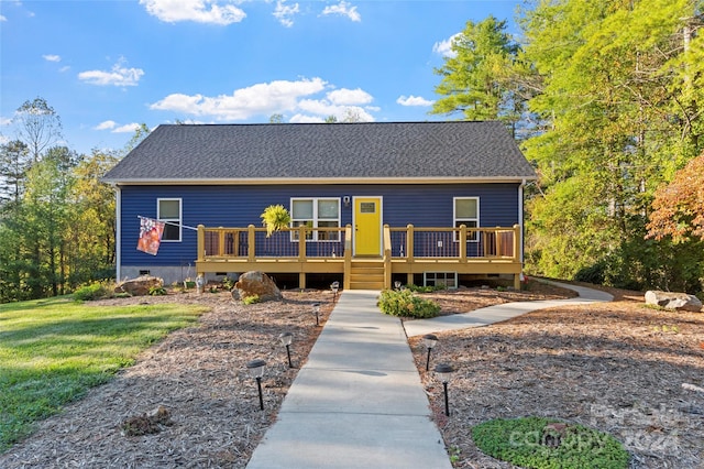 view of front of property with a wooden deck