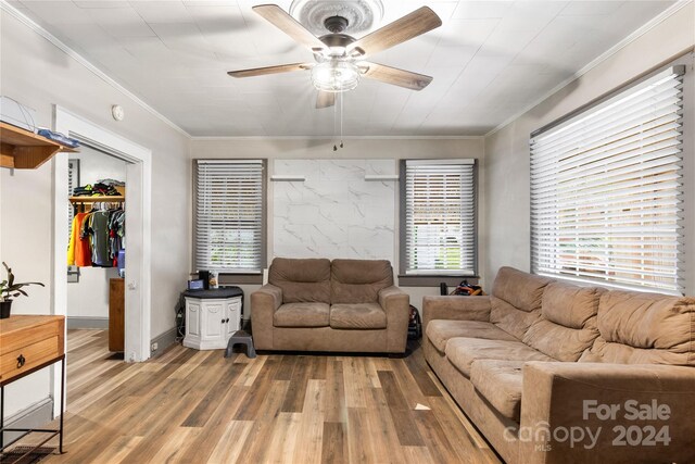 515 Suttle St, Shelby, NC 28150 - living area with ceiling fan, ornamental molding, and light wood-style flooring