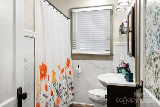 515 Suttle St, Shelby, NC 28150 - bathroom featuring tile walls, toilet, a shower with shower curtain, and vanity