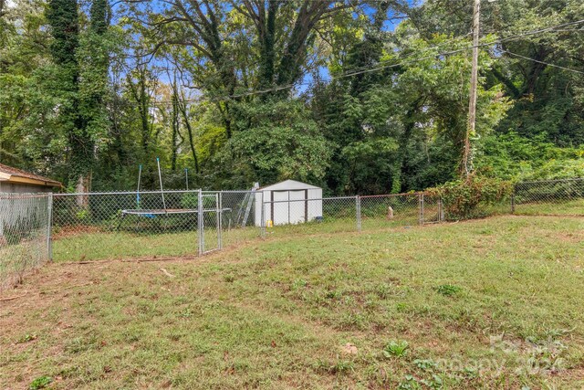 515 Suttle St, Shelby, NC 28150 - view of yard with an outdoor structure, a fenced backyard, and a shed