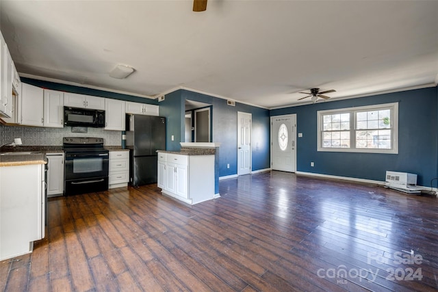 kitchen with dark hardwood / wood-style flooring, backsplash, white cabinetry, and black appliances