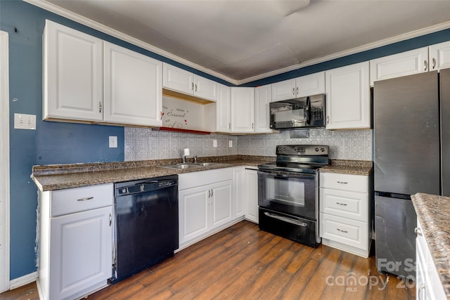 kitchen featuring black appliances, white cabinetry, dark wood-type flooring, and ornamental molding