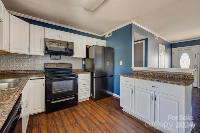 kitchen featuring white cabinets, dark hardwood / wood-style floors, ornamental molding, and black appliances