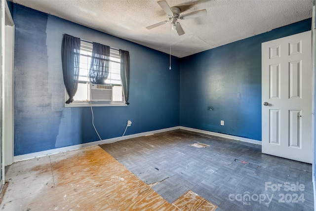 unfurnished room featuring hardwood / wood-style floors, a textured ceiling, and ceiling fan