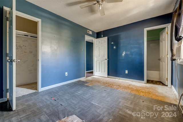 unfurnished bedroom with a textured ceiling, a closet, and ceiling fan