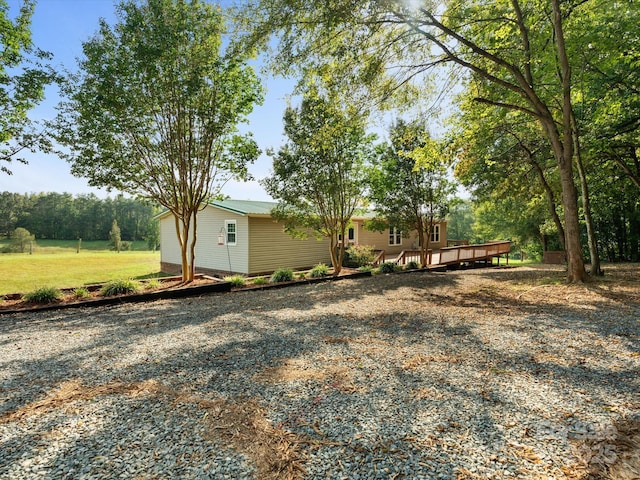 view of yard featuring a wooden deck