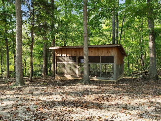 view of poultry coop with a view of trees