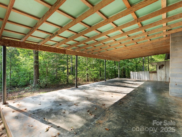 view of patio featuring a forest view