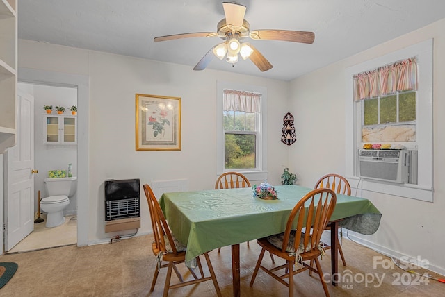 dining space with ceiling fan, cooling unit, and heating unit