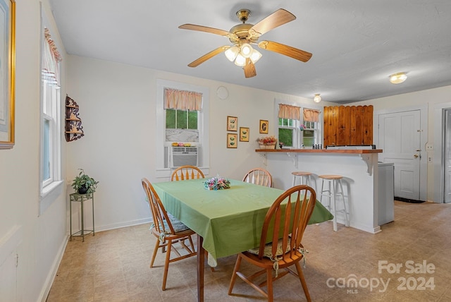 dining space featuring ceiling fan and cooling unit