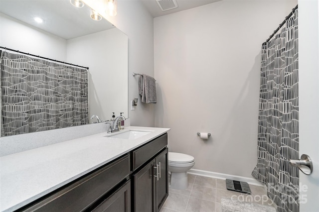 bathroom with toilet, vanity, tile patterned floors, and curtained shower