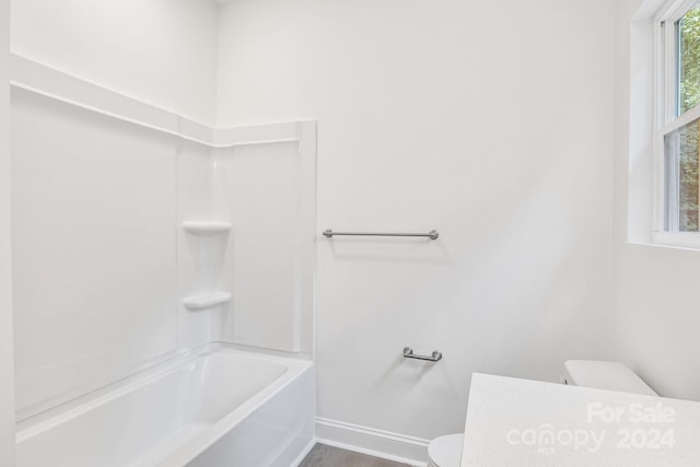 full bathroom featuring shower / bathtub combination, hardwood / wood-style flooring, vanity, and toilet