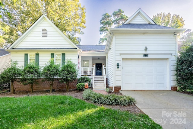 view of front of property featuring a garage and covered porch