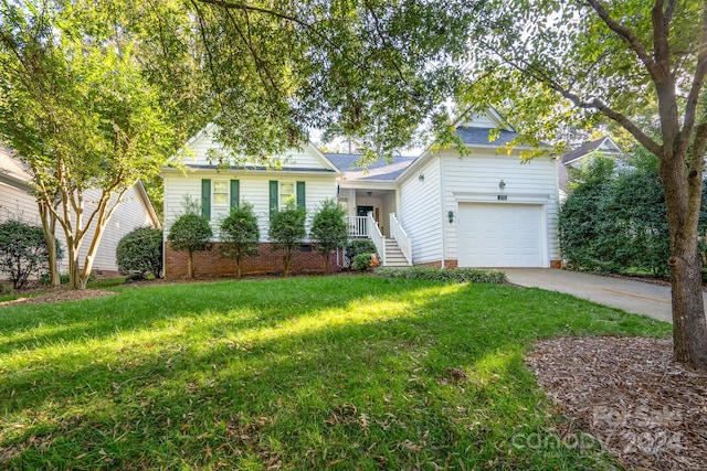 view of front of house featuring a front yard and a garage