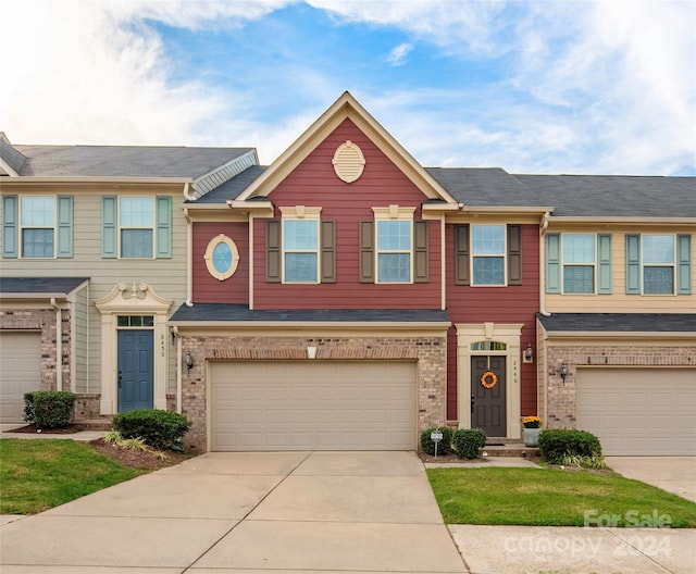 multi unit property featuring a garage