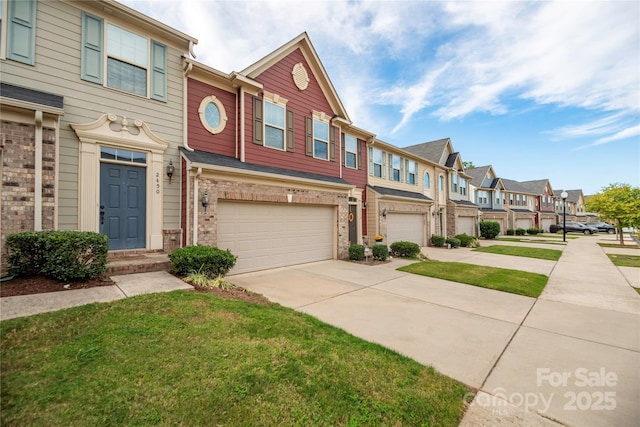 townhome / multi-family property featuring a garage, driveway, brick siding, and a residential view