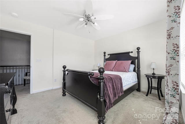 bedroom with ceiling fan, baseboards, and carpet flooring