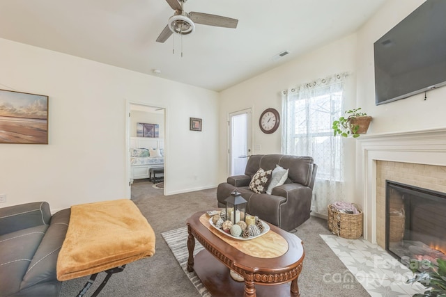 carpeted living room featuring ceiling fan