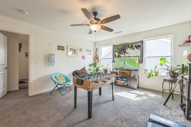 game room with carpet flooring and ceiling fan