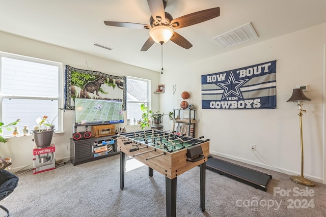 recreation room with ceiling fan and carpet floors