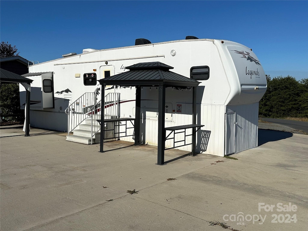 exterior space featuring a gazebo and a patio area