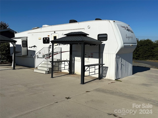 exterior space featuring a gazebo and a patio area