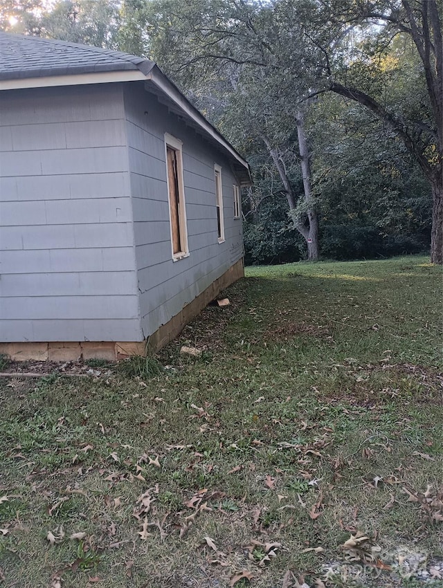 view of home's exterior featuring a lawn