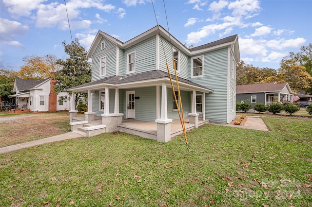 view of front of property featuring a front yard and covered porch